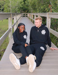 Couple wearing Elevated Faith Christian Apparel Sweatpants for a comfortable and stylish look outdoors
