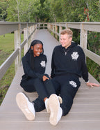Couple wearing Elevated Faith Christian Apparel Sweatpants for a comfortable and stylish look outdoors
