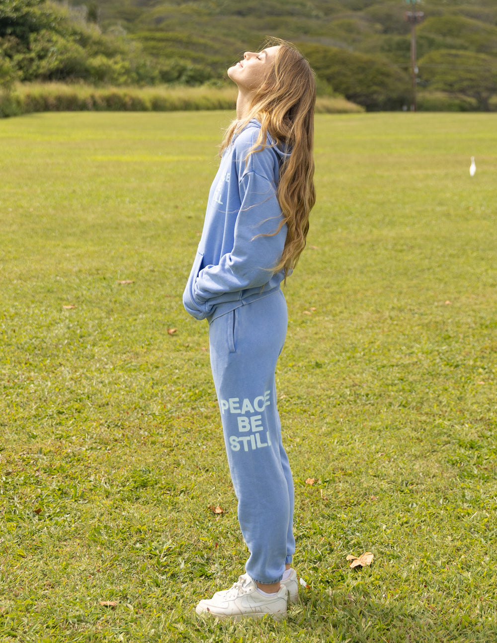 Elevated Faith blue sweatpants with 'Peace Be Still' print, part of Christian Apparel collection