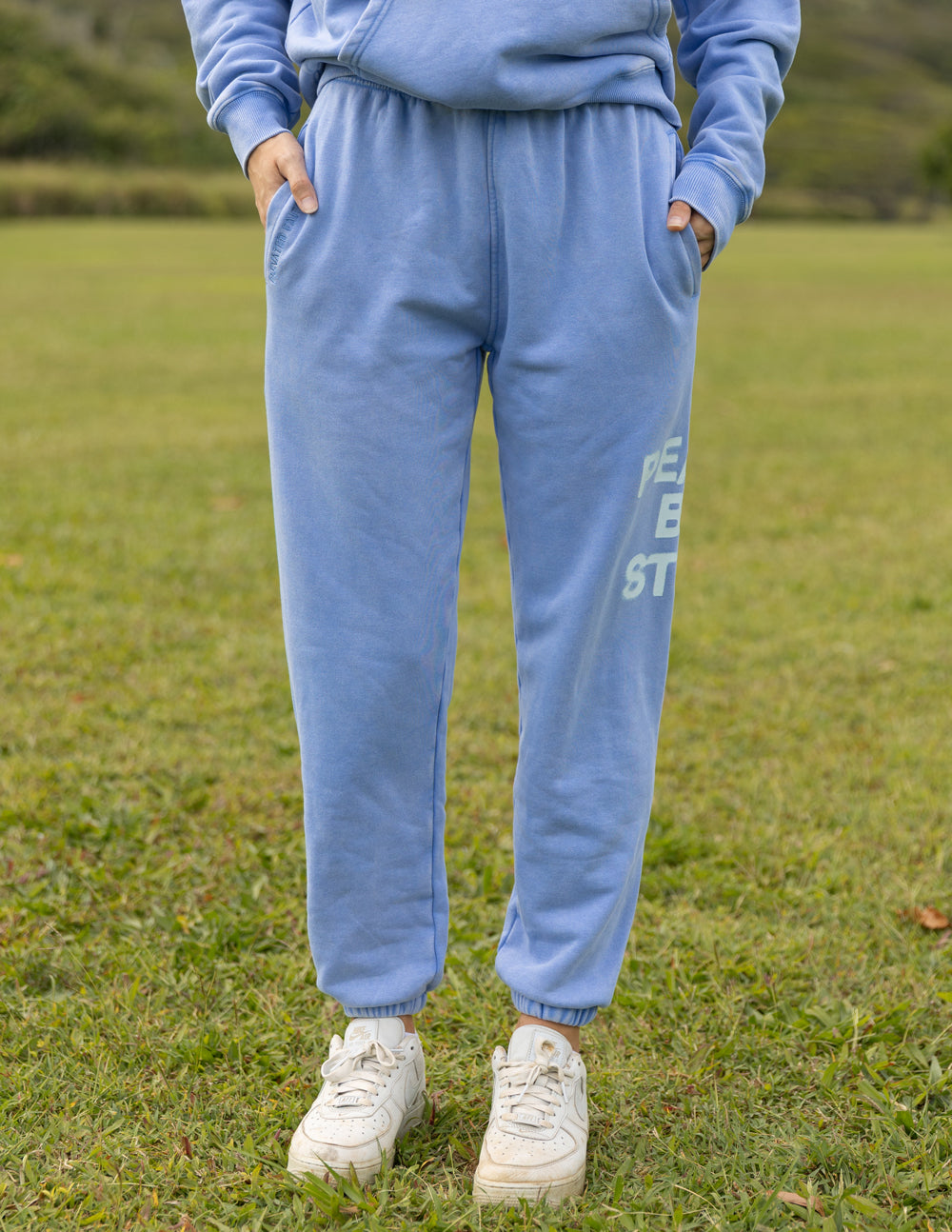 Light blue sweatpants from Elevated Faith featuring pockets, perfect for Christian Apparel enthusiasts