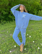 Light blue Elevated Faith sweatpant set featuring 'Peace Be Still' slogan, perfect for Christian Apparel