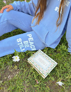Elevated Faith Blue Sweatpants featuring 'Peace Be Still' design, showcasing Christian Apparel for relaxed style