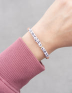 Elevated Faith Christian Jewelry Bracelet with beads spelling Perfect Love on a wrist