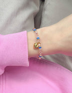Elevated Faith Christian Jewelry Bracelet with pastel beads and a heart charm on a wrist