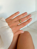 Elevated Faith Gold Shell Ring on Hand, a piece of elegant Christian Jewelry for everyday wear