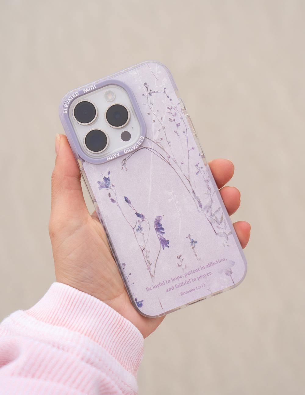 Elevated Faith Christian iPhone Case with Floral Design and Inspirational Quote on a Purple Background