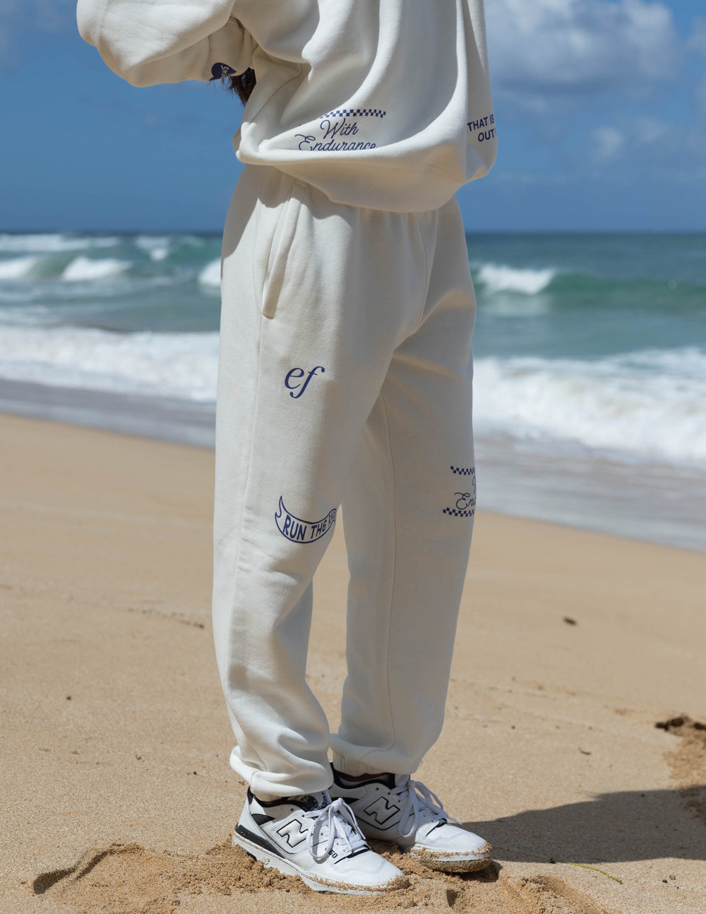 Elevated Faith Cream Sweatpants featuring Christian Apparel design, ideal for casual wear at the beach