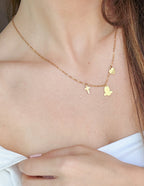 Elevated Faith Christian Jewelry Gold Necklace with Cross and Dove Charms on a Delicate Chain