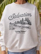 Gray Christian Crewneck Sweatshirt featuring 'Salvation' graphic and nature scene for comfortable wear