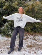 Model wearing Elevated Faith Christian Crewneck Sweatshirt featuring a stylish winter design outdoors