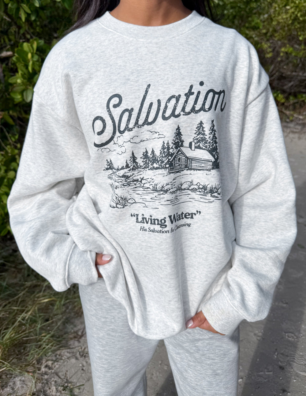 Elevated Faith Christian Crewneck Sweatshirt featuring a serene nature design with the word Salvation