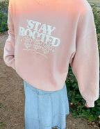 Pink Christian Crewneck Sweatshirt featuring a floral design and 'Stay Rooted' text
