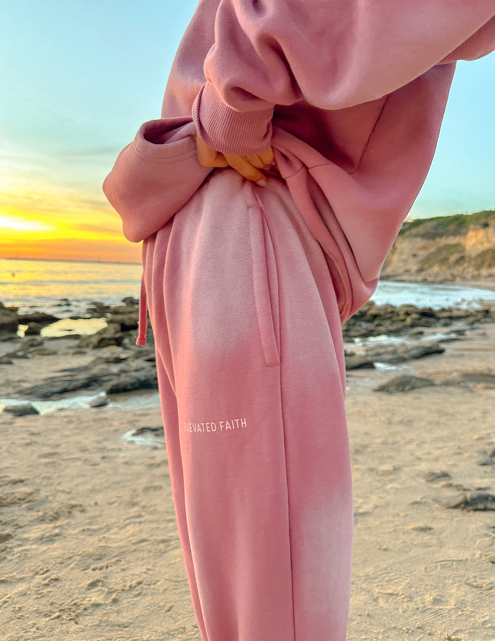 Elevated Faith Pink Sweatpants with a Relaxed Fit and Christian Apparel branding for comfort