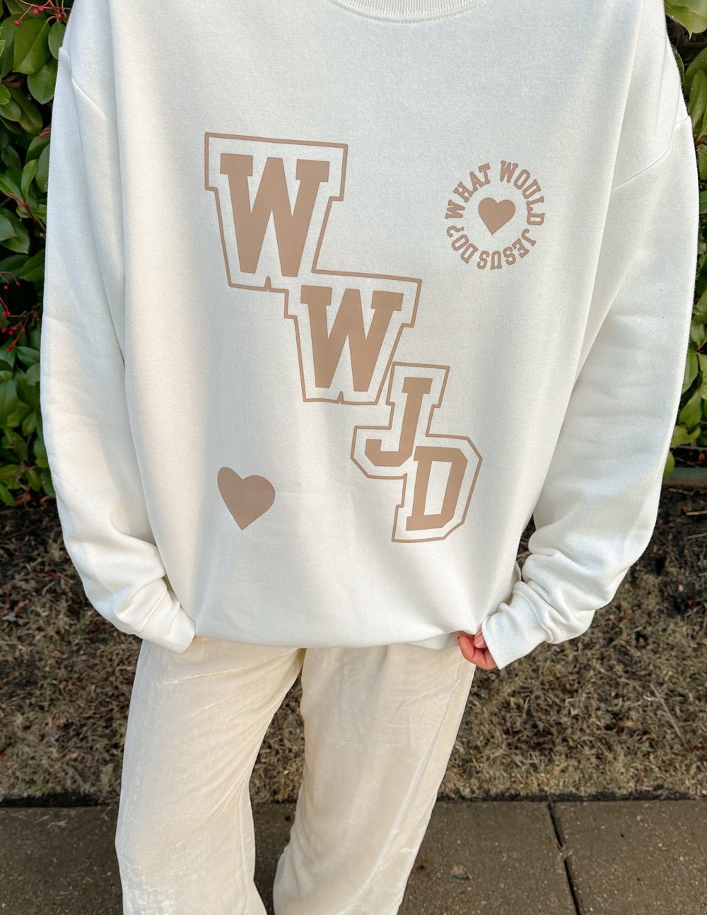 Elevated Faith Christian Crewneck Sweatshirt in off-white with What Would Jesus Do design