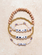 Set of three Elevated Faith Christian Bracelets with WWJD beads and decorative accents