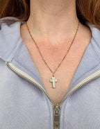 Elevated Faith Christian Jewelry featuring a delicate cross pendant on a gold chain