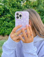 Christian iPhone Case with Floral Design Held by a Person Outdoors