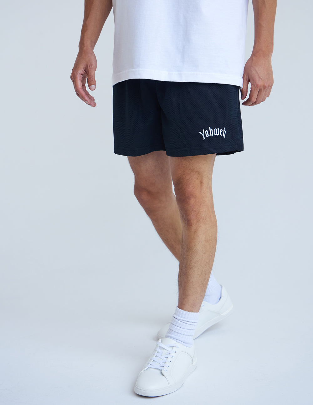 Men's Elevated Faith Christian Shorts in black featuring Yahweh graphic for casual wear