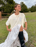 Elevated Faith Christian Apparel T-Shirt in soft cream color featuring inspirational graphics