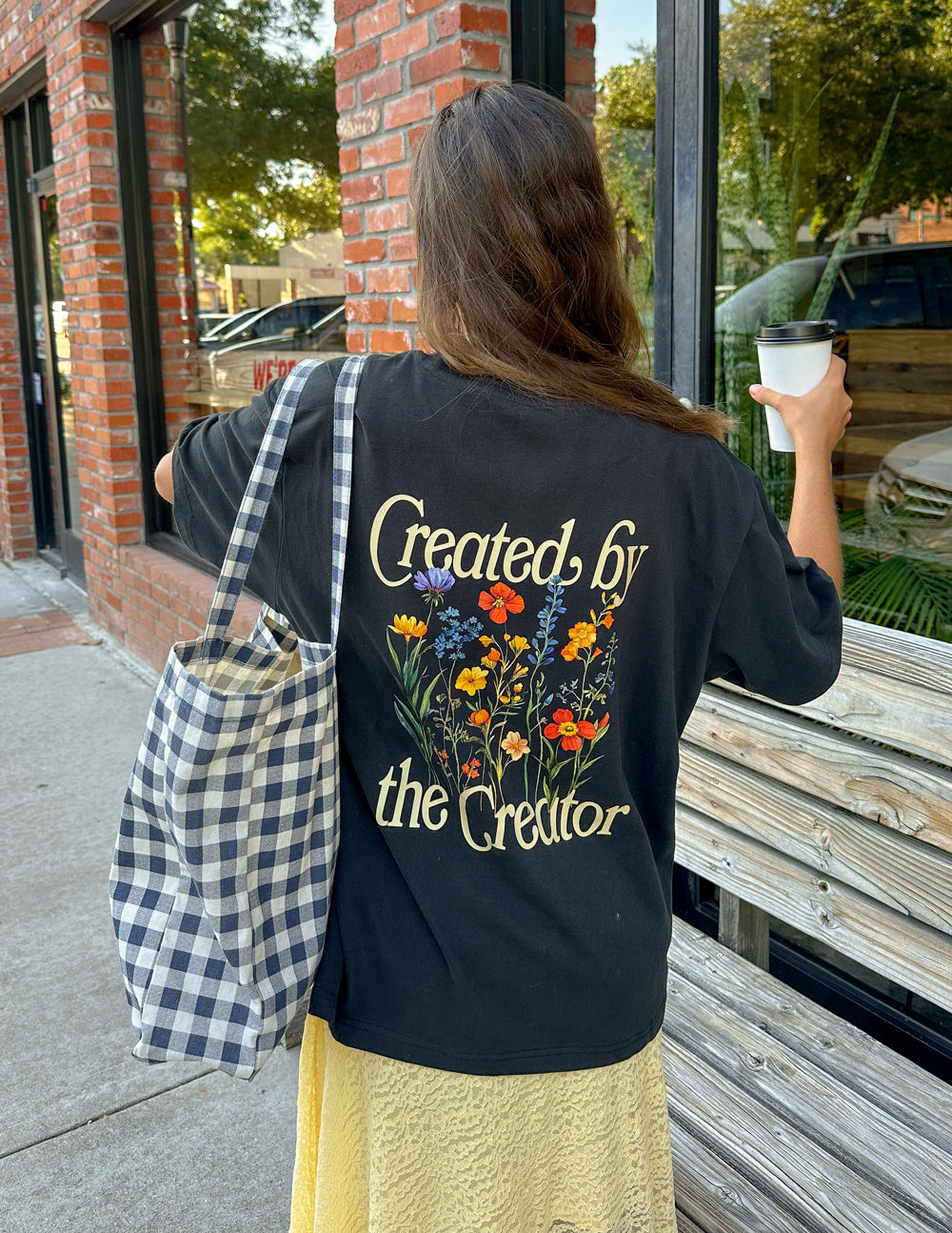 Elevated Faith Christian Apparel T-Shirt featuring a floral design and 'Created by the Creator' text