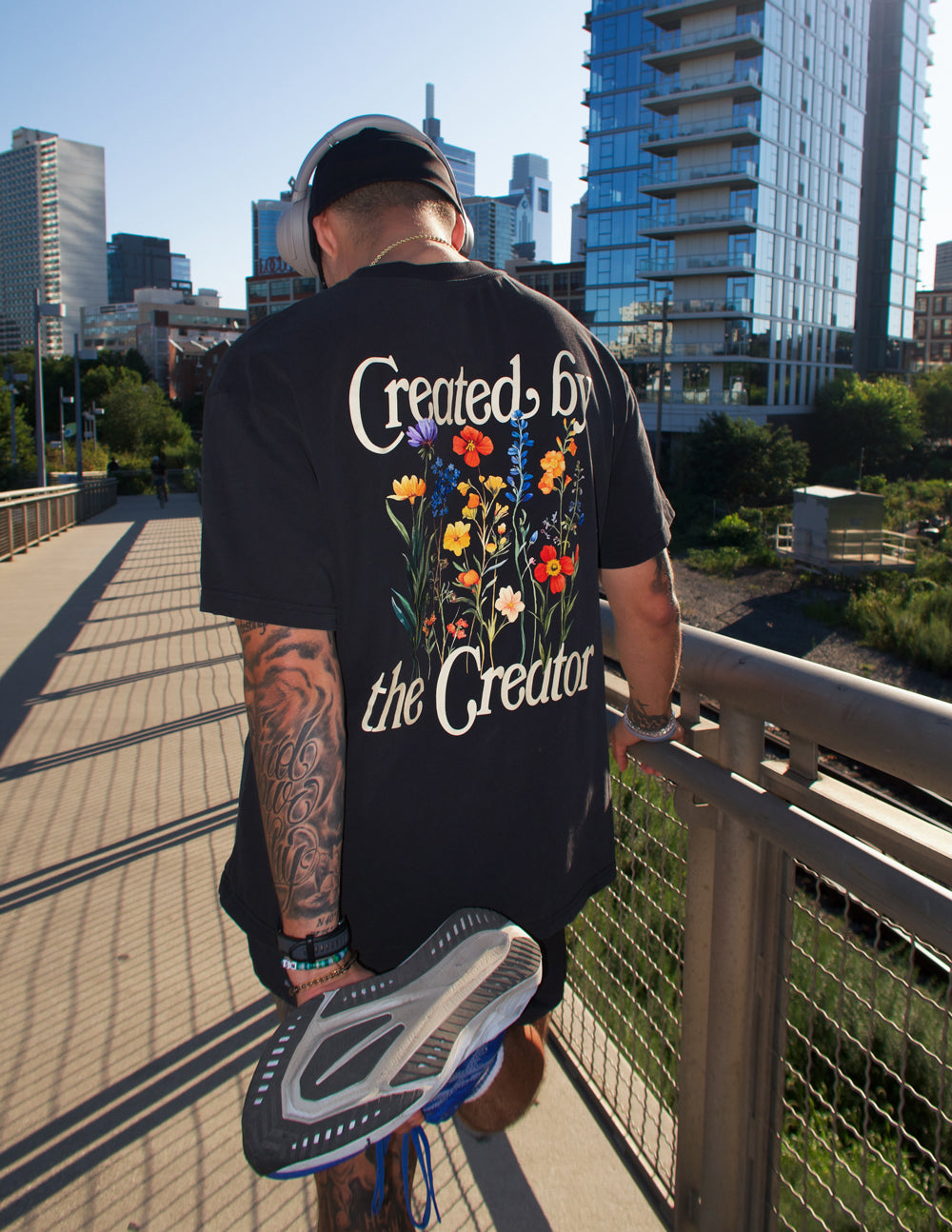Elevated Faith Christian Apparel T-Shirt featuring floral design and 'Created by the Creator' print on back