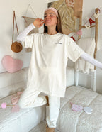 Elevated Faith Christian Apparel T-Shirt in cream color, worn casually for a comfortable look