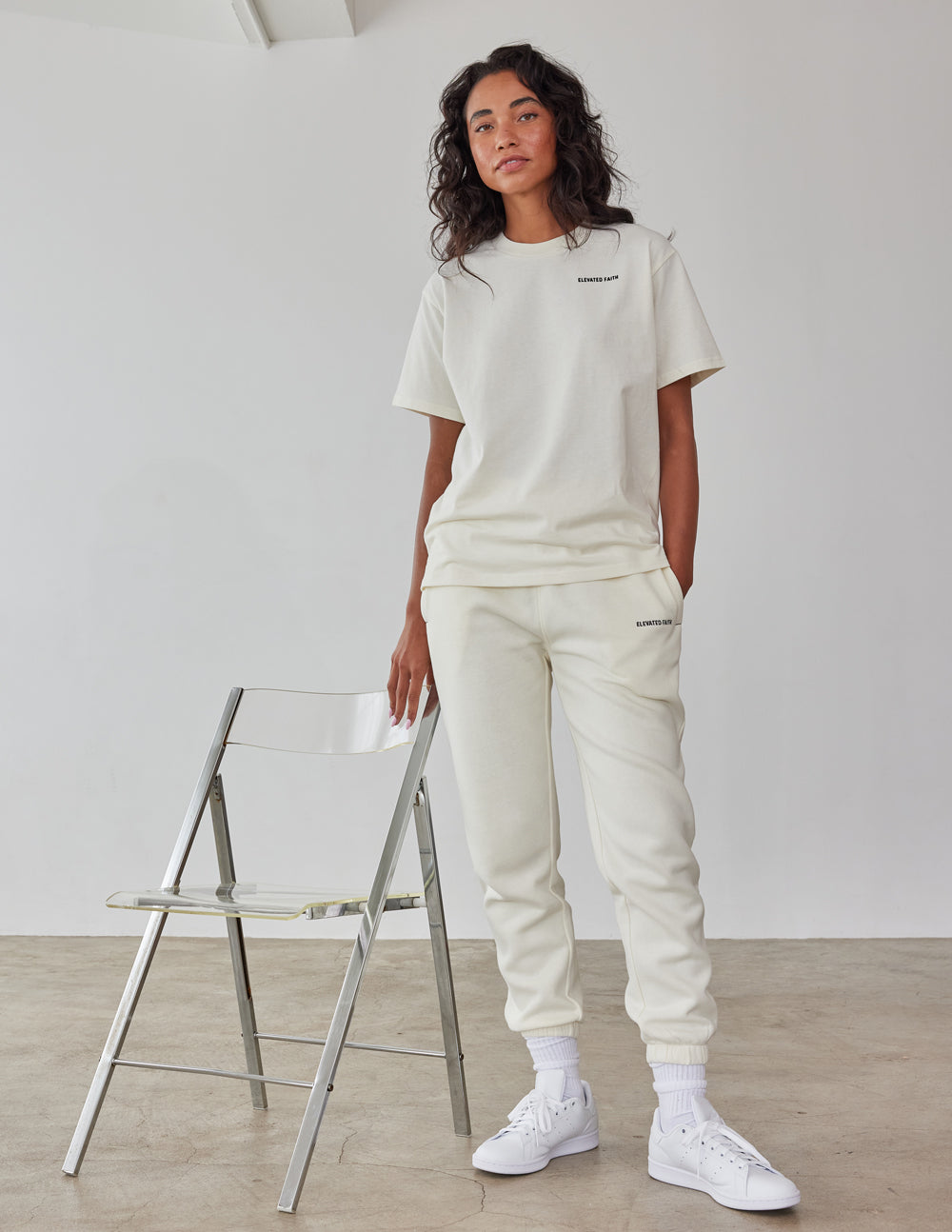 Elevated Faith Christian Apparel T-Shirt in soft cream color, paired with matching joggers