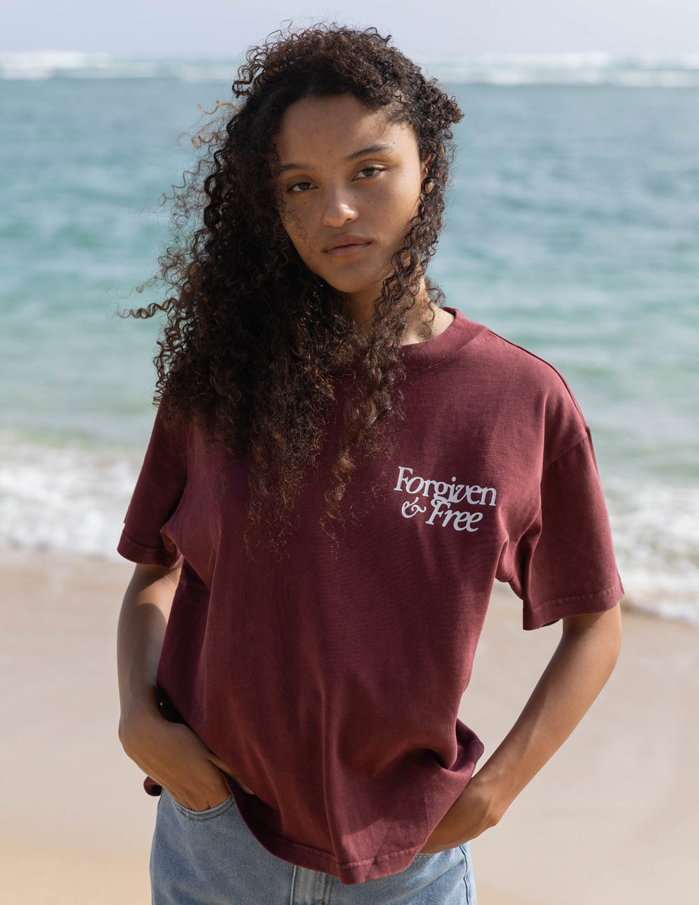 Elevated Faith Christian Apparel T-Shirt in Burgundy with 'Forgiven & Free' Design on Beach