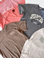 Variety of Elevated Faith Christian Apparel T-Shirts in different colors and designs for inspirational fashion