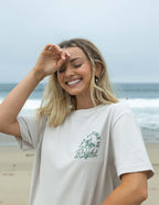 Elevated Faith Christian Apparel T-Shirt featuring a nature-inspired design and relaxed fit at the beach