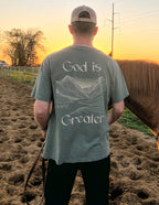 Men's Elevated Faith Christian Apparel T-Shirt featuring a mountain design and 'God is Greater' text