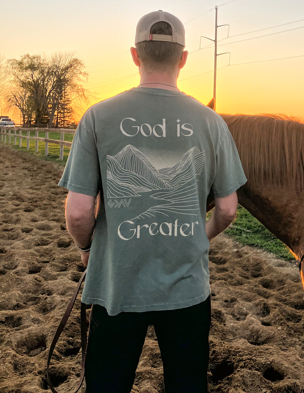 Men's Elevated Faith Christian Apparel T-Shirt featuring a mountain design and 'God is Greater' text
