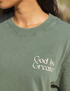 Elevated Faith Christian Apparel T-Shirt in olive green with 'God is Greater' graphic on the front