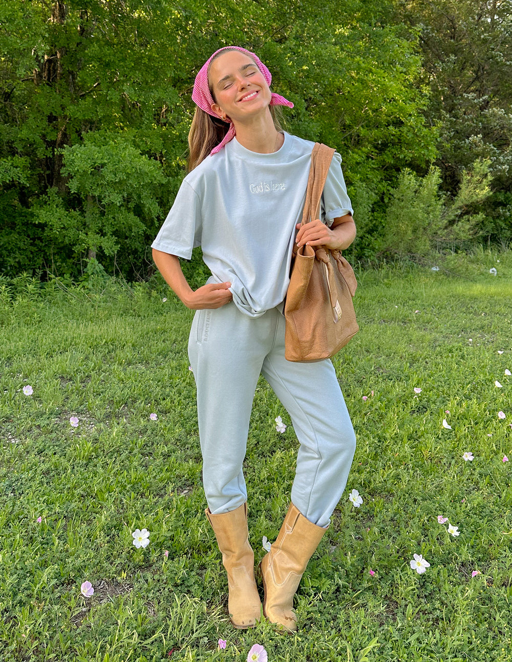 Elevated Faith Christian Apparel T-Shirt in light blue, styled with matching relaxed pants and a casual bag