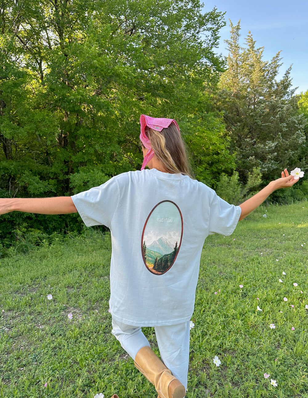 Elevated Faith Christian Apparel T-Shirt in light blue with a scenic mountain graphic on the back