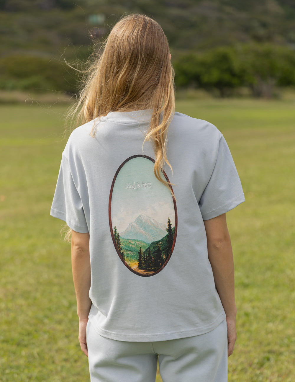 Back view of Elevated Faith Christian Apparel T-Shirt featuring a scenic mountain print