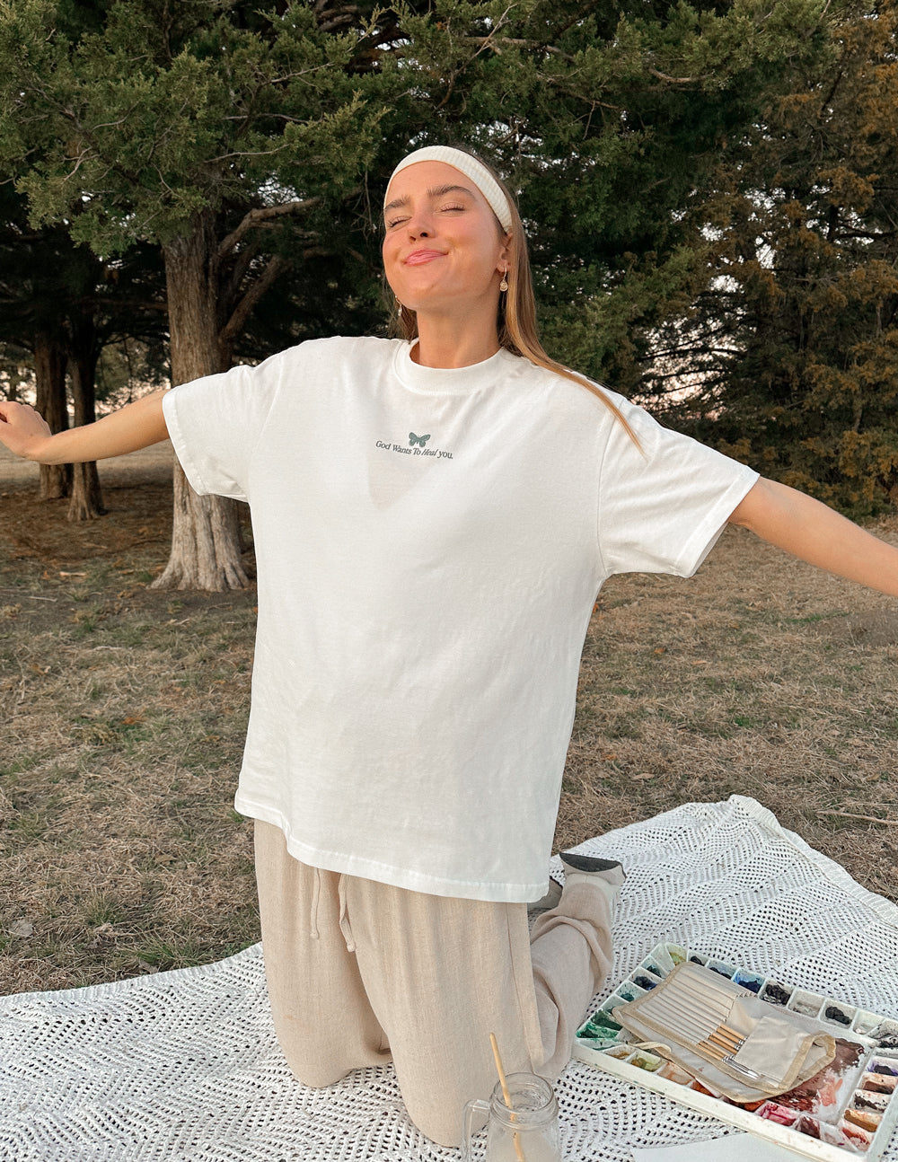 Elevated Faith Christian Apparel T-Shirt in white featuring a butterfly design for relaxed casual wear