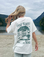 Elevated Faith Christian Apparel T-Shirt with 'God Wants To Heal You' graphic in nature setting