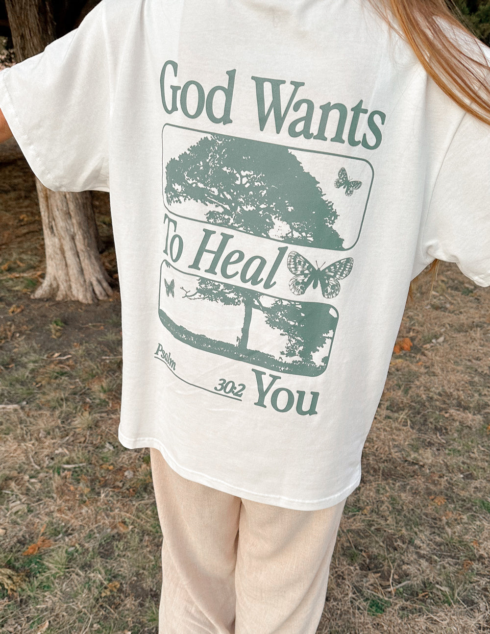 Elevated Faith Christian Apparel T-Shirt featuring the message 'God Wants To Heal You' with nature design