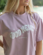 Elevated Faith Good News Christian Apparel T-Shirt in pastel pink for stylish faith expression