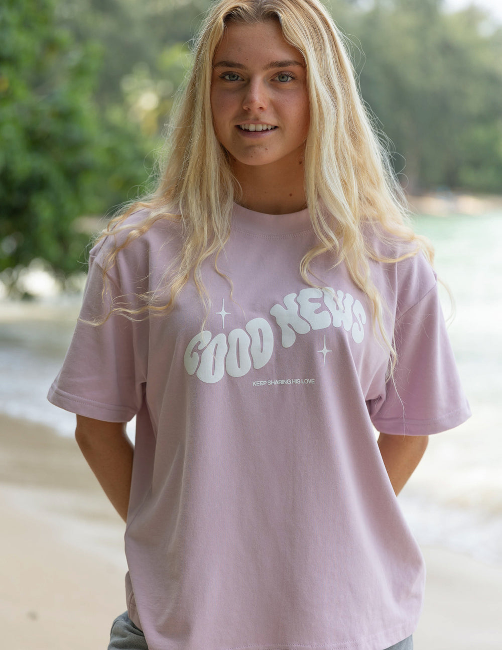 Elevated Faith Christian Apparel T-Shirt in light pink with 'Good News' graphic design