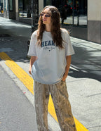Elevated Faith Christian Apparel T-Shirt in light blue with 'Hear Me God' print, styled casually on the street