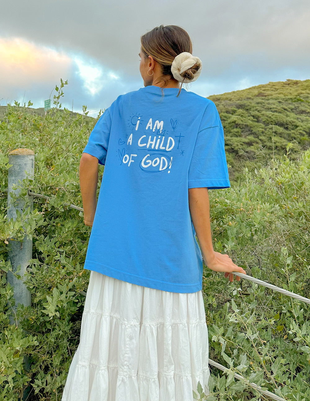Elevated Faith Christian Apparel T-Shirt in Blue featuring 'I Am a Child of God' printed on the back