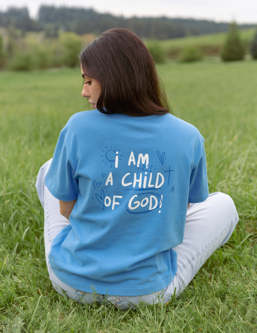 Elevated Faith Christian Apparel T-Shirt in Blue with 'I am a child of God' design on the back