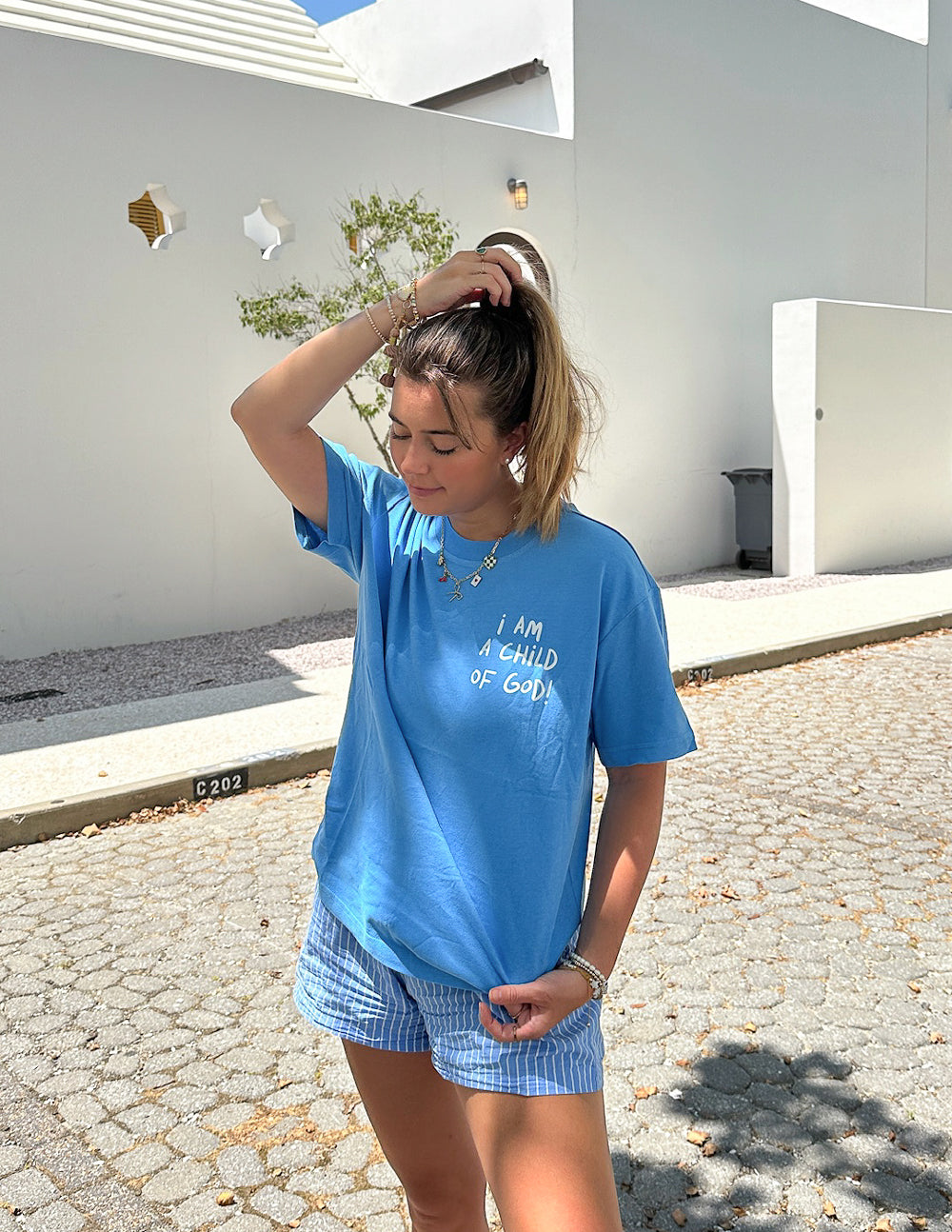Light blue Christian Apparel T-Shirt with 'I am a child of God' text for casual and stylish wear