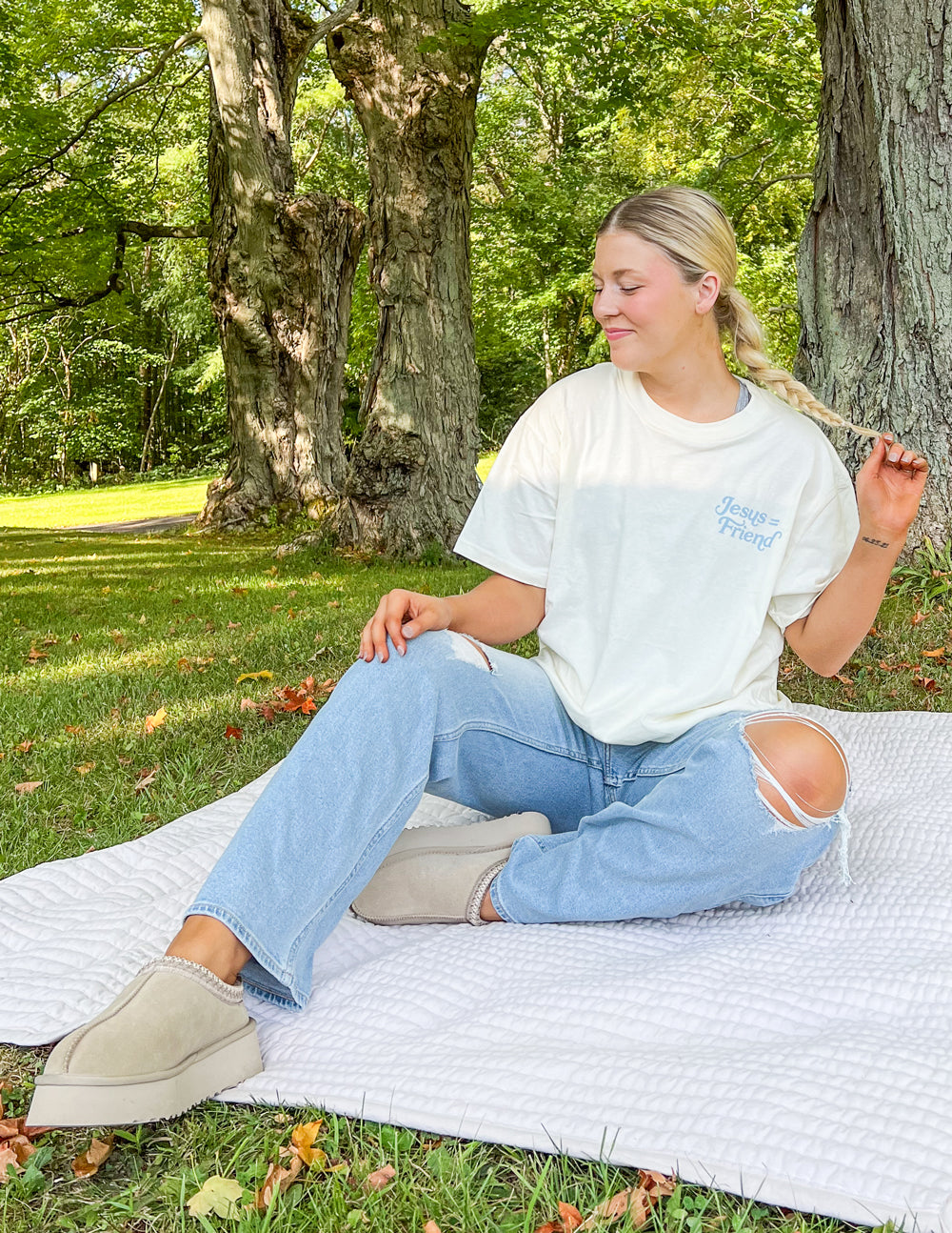 Model wearing Elevated Faith Christian Apparel T-Shirt in a serene outdoor setting