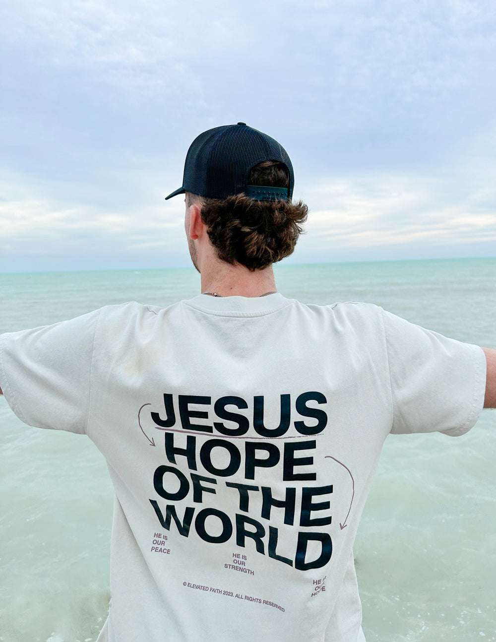 Elevated Faith Christian Apparel T-Shirt featuring 'Jesus Hope of the World' graphic on the back