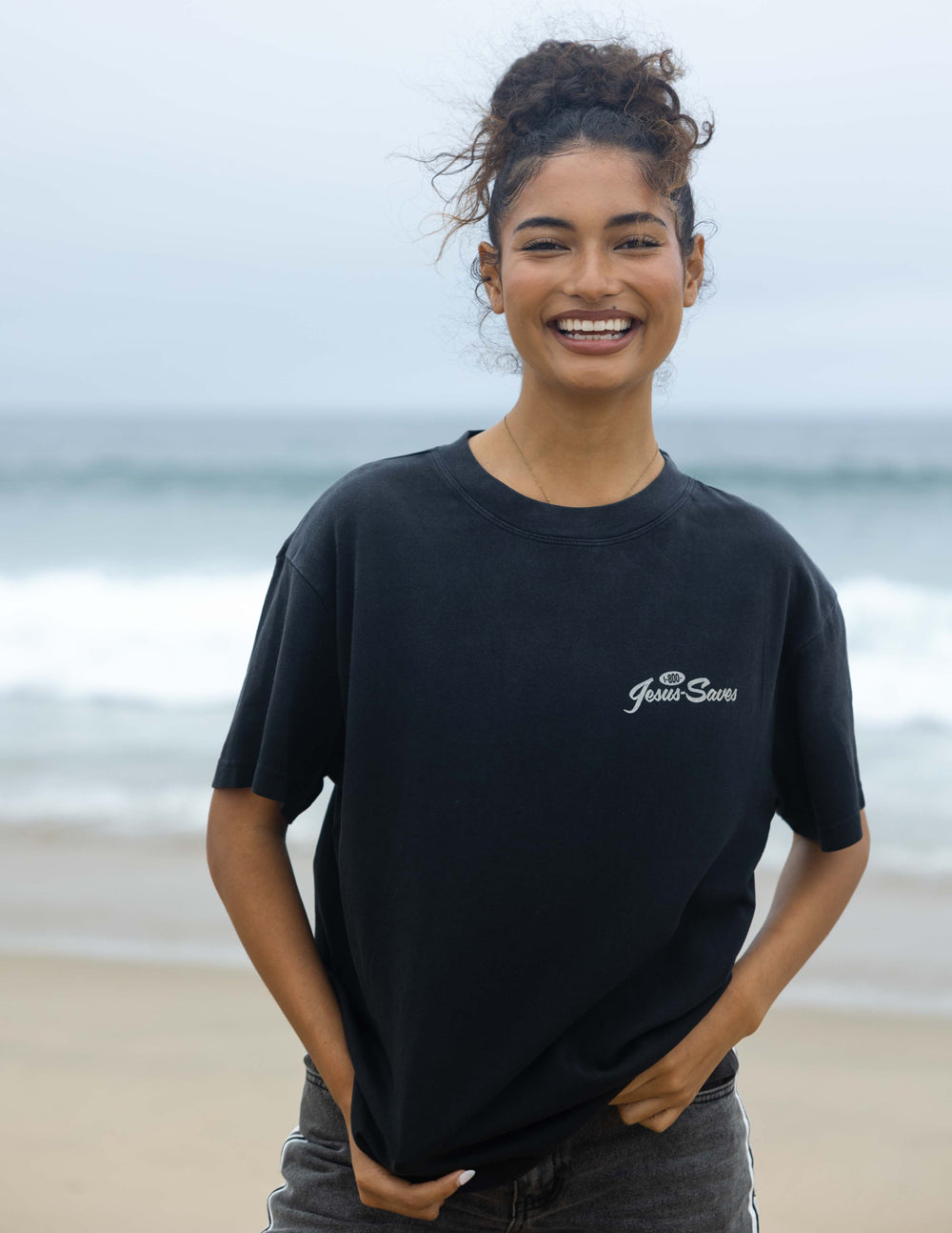 Elevated Faith Christian Apparel T-Shirt in black with 'Jesus Saves' graphic, perfect for beach outings