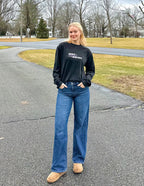 Elevated Faith Christian Apparel T-Shirt in black with graphic design, styled with jeans and boots