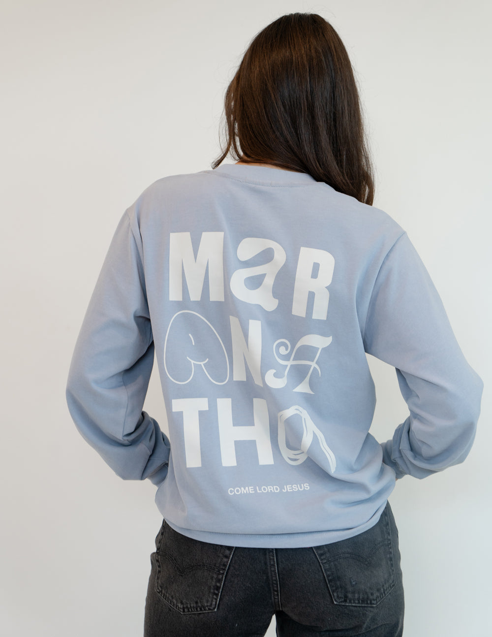 Elevated Faith Christian Apparel T-Shirt in light blue with bold white lettering on the back